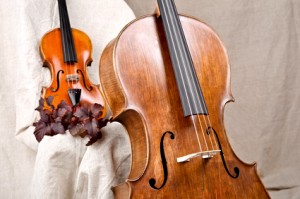 violin and cello on the beige background